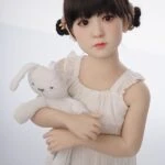 Realistic female doll holding plush bunny, high-quality sex doll mini with lifelike features, ideal for companionship and intimate pleasure, discreet packaging, premium craftsmanship.