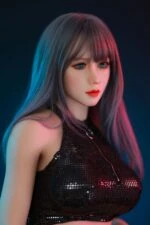Realistic female sex doll with long hair, wearing a black sequined top, under colorful lighting for a sensual aesthetic.