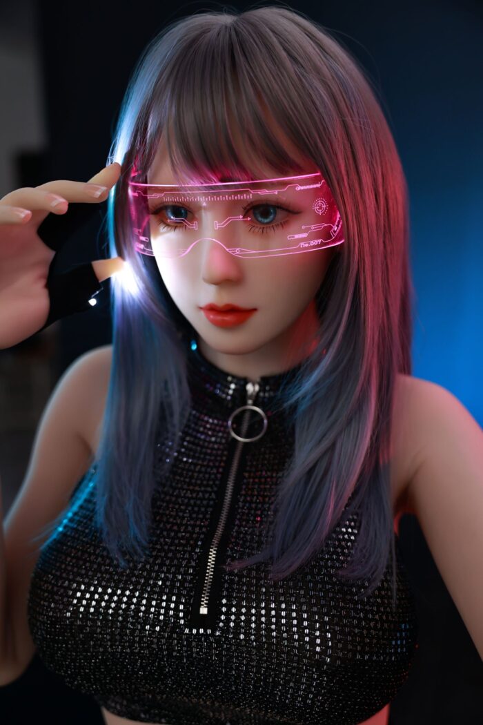 Close-Up Of A Realistic Sex Doll With Purple And Blue Hair Wearing Pink Futuristic Glasses, In A Dark Setting.