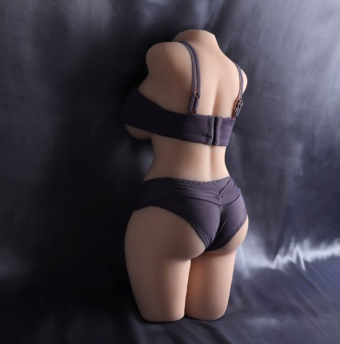 Close-Up Of A Sex Doll'S Back, Dressed In Black Lingerie, Highlighting Realistic Skin Texture And Detailed Body Features.