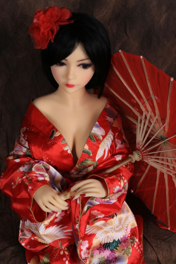 Silicone Sex Doll Dressed In A Red Floral Kimono Holding A Red Parasol, Showcasing Realistic Features, Perfect For Intimate Companionship, With A Focus On High-Quality Materials And Lifelike Appearance.