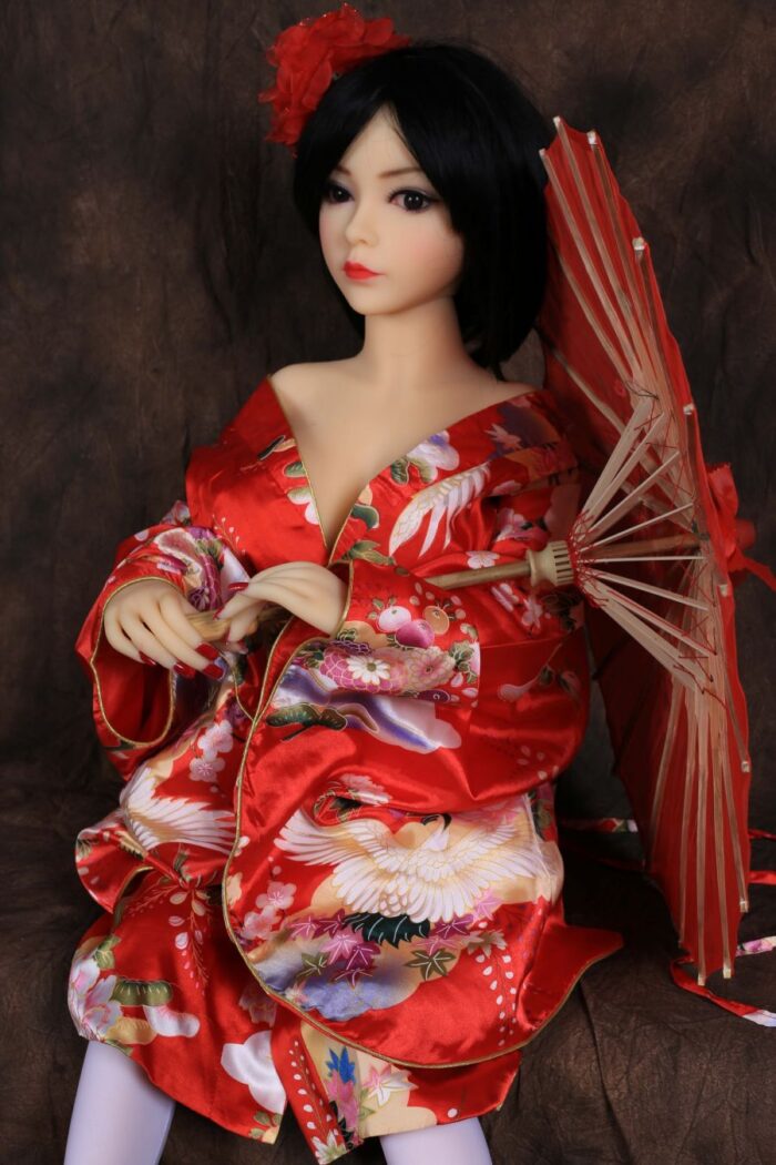 Soft Silicone Sex Doll With Lifelike Features Wearing Vibrant Red Kimono With Floral And Crane Motifs, Holding A Traditional Parasol, Creating An Authentic Japanese Aesthetic.
