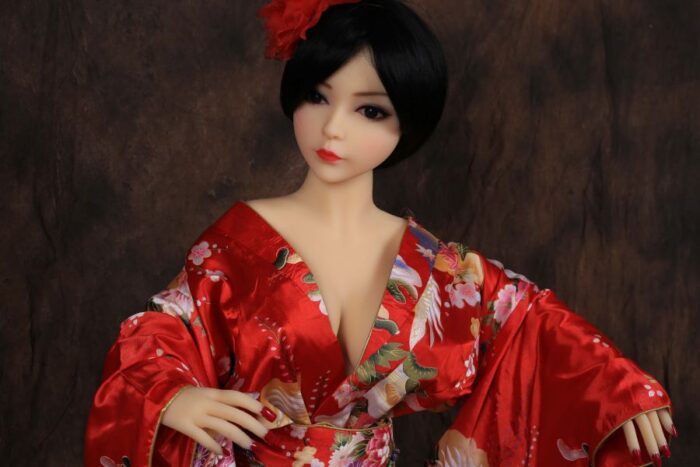 Realistic Sex Doll With Asian Features Wearing A Traditional Red Kimono, Lifelike Details, High-Quality Silicone Construction, Perfect For Intimate Companionship And Pleasure, Available At Sexdollmini.com.
