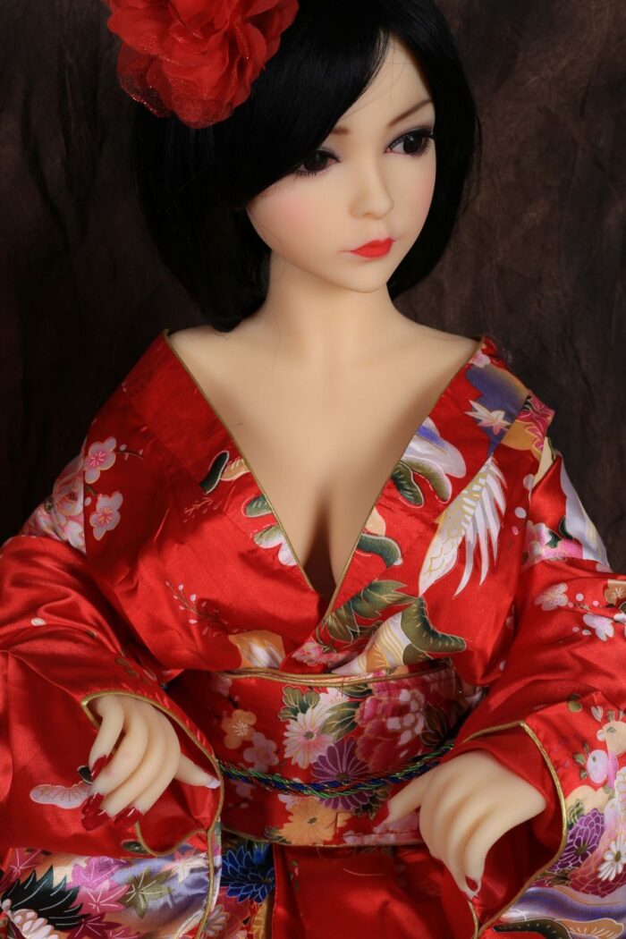 Silicone Sex Doll With Realistic Features, Elegant Black Hair, And Wearing A Vibrant Red Kimono With Floral Patterns, Perfect For Companionship And Adult Entertainment.