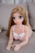 Realistic sex doll with blue eyes and long blonde hair, dressed in delicate lace lingerie, ideal for adult companionship, designed for lifelike experience and comfort.