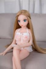 Realistic sex doll with a petite body and long blonde hair, dressed in lace lingerie, designed for adult pleasure and intimacy, available at Sexdollmini.