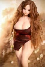 Realistic sex doll with long, wavy auburn hair wearing a shiny red dress, designed for intimate companionship, high-quality material, lifelike appearance, perfect for adult pleasure and collector enthusiasts.