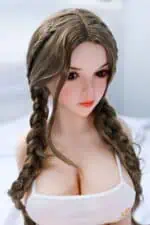 Soft silicone sex doll with realistic facial features, long braided hair, and a white tank top, designed for companionship and adult pleasure, emphasizing high-quality craftsmanship.