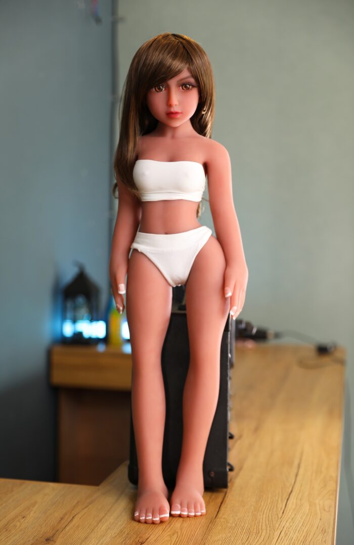 High-Quality Sex Doll With Realistic Features, Long Brown Hair, And Detailed Facial Expression Designed For Adult Pleasure And Companionship. Perfect For Intimate Experiences.