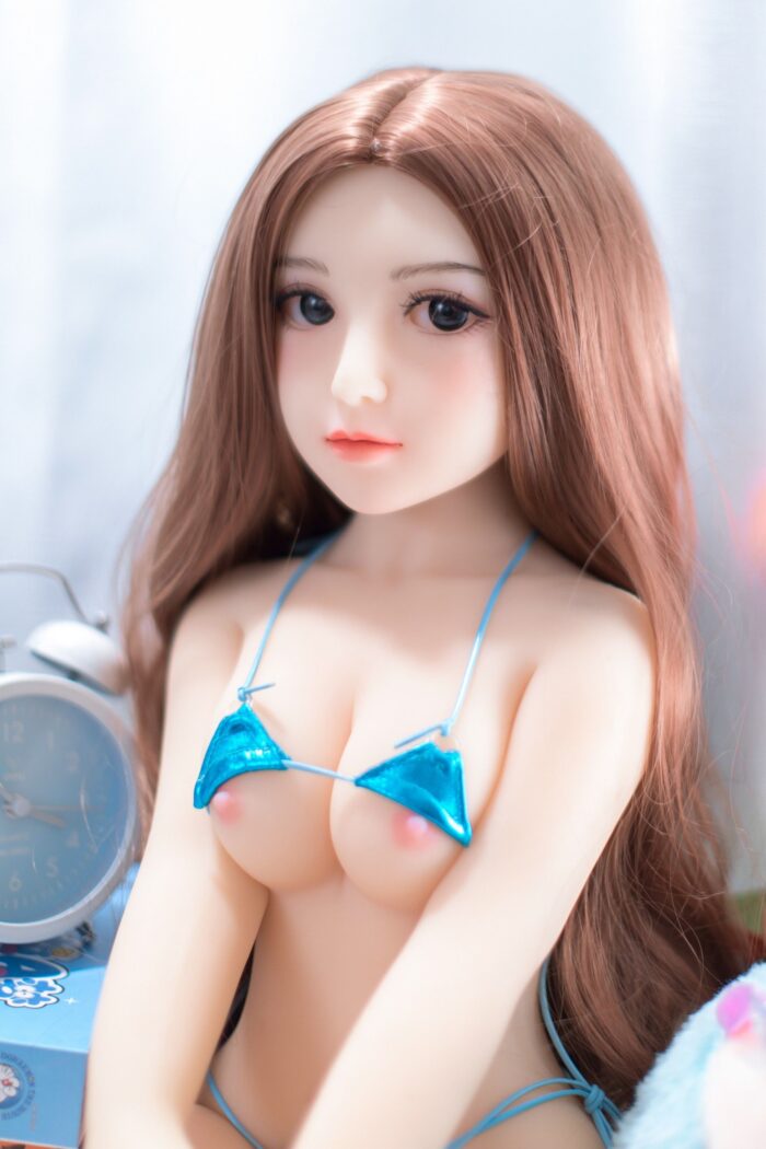 Realistic Sex Doll With Long Brown Hair, Blue Bikini Top, And Lifelike Features For Adult Pleasure And Companionship.