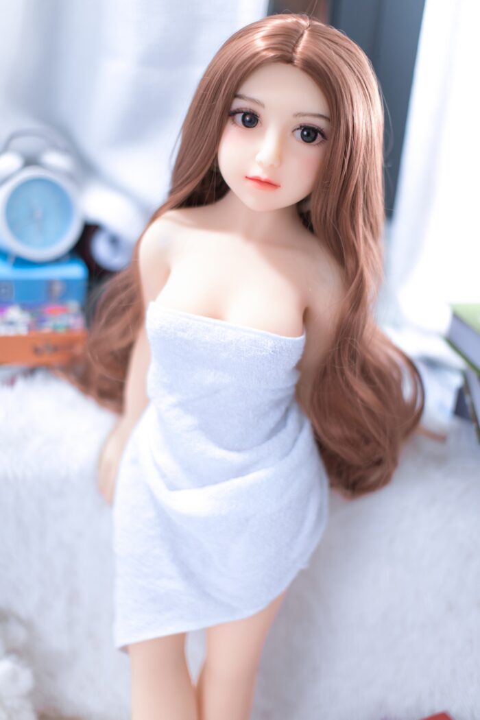 Realistic Sex Doll With Detailed Features And Long Brown Hair, Ideal For Companionship And Adult Pleasure, Showcased In A Cozy, Private Setting. Perfect For Those Seeking High-Quality, Lifelike Adult Dolls.